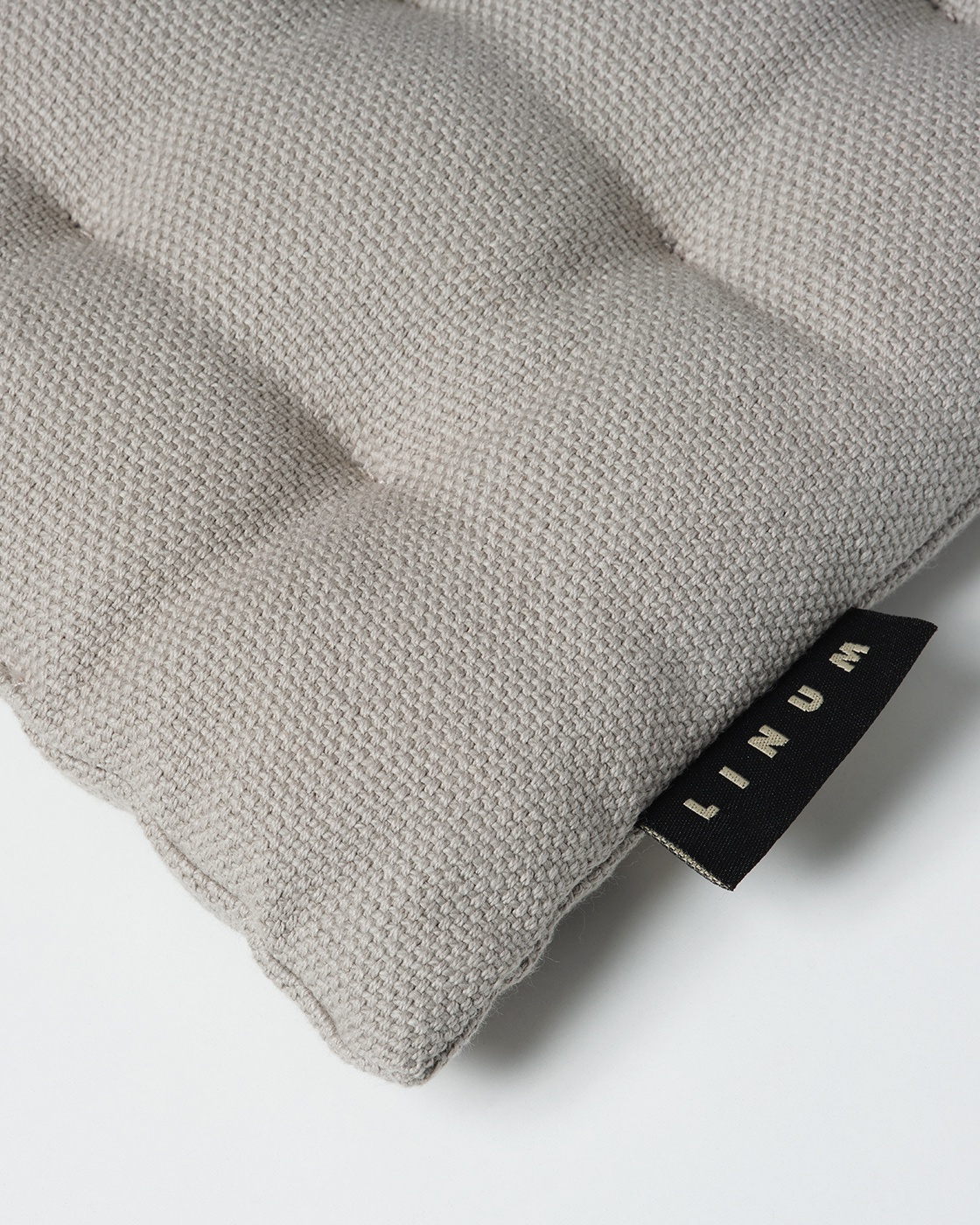 Product image light grey PEPPER seat cushion made of soft cotton with recycled polyester filling from LINUM DESIGN. Size 40x40 cm.