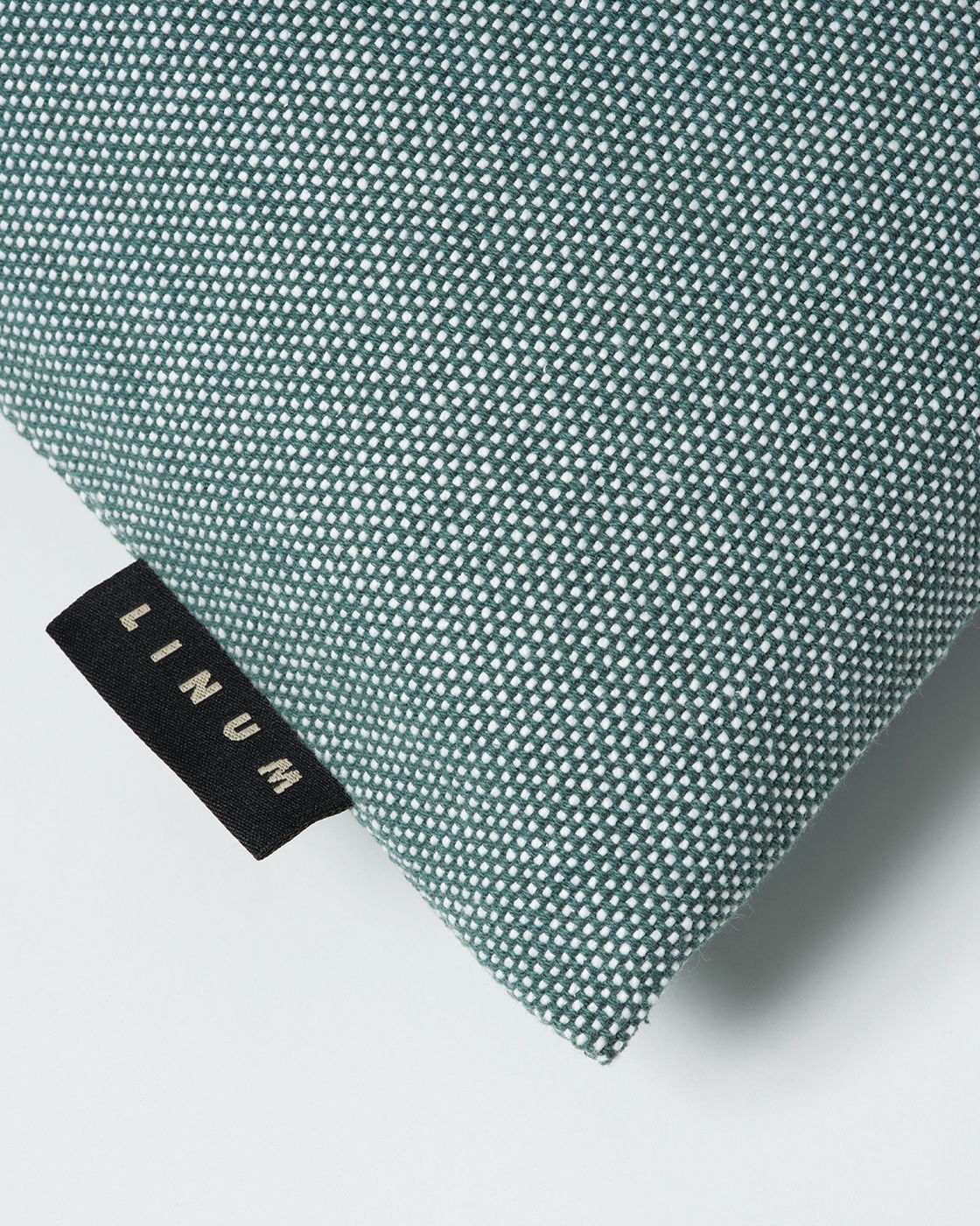 Product image dark grey turquoise PEPPER cushion cover made of soft cotton from LINUM DESIGN. Easy to wash and durable for generations. Size 50x50 cm.