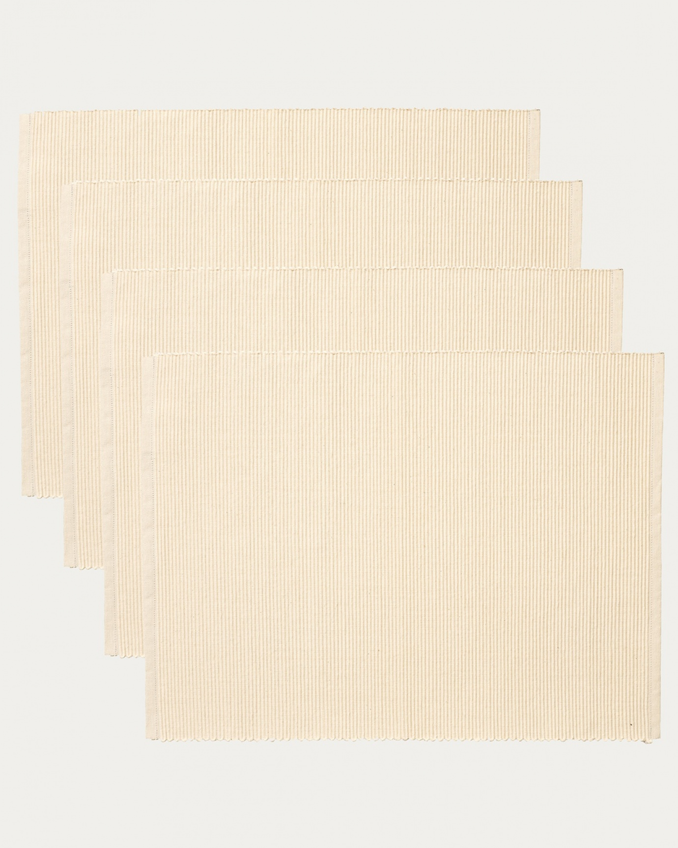 Product image creamy beige UNI placemat made of soft cotton in ribbed quality from LINUM DESIGN. Size 35x46 cm and sold in 4-pack.