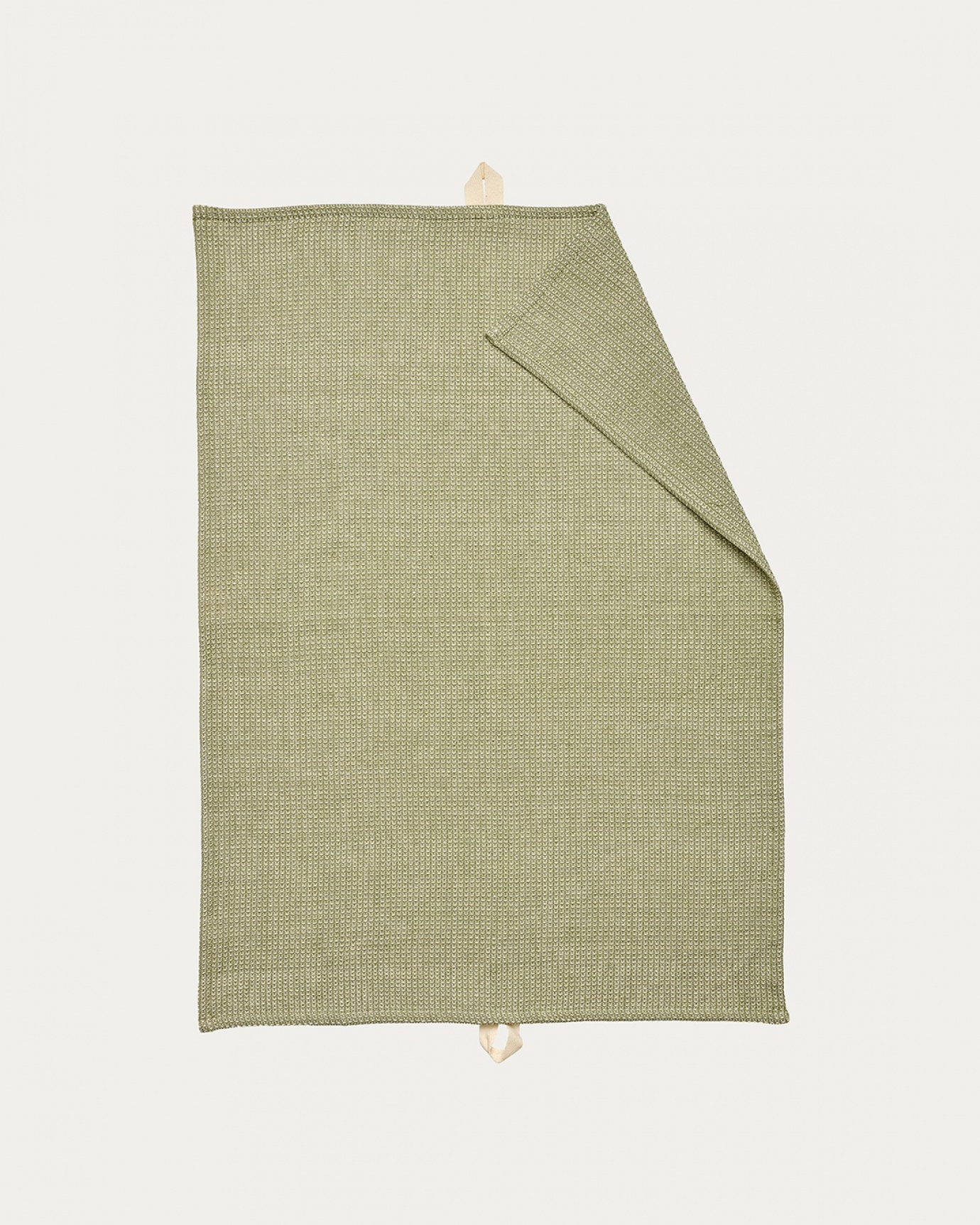 Product image light cypress green AGNES kitchen towel made of soft cotton in a waffle structure from LINUM DESIGN. Size 50x70 cm.