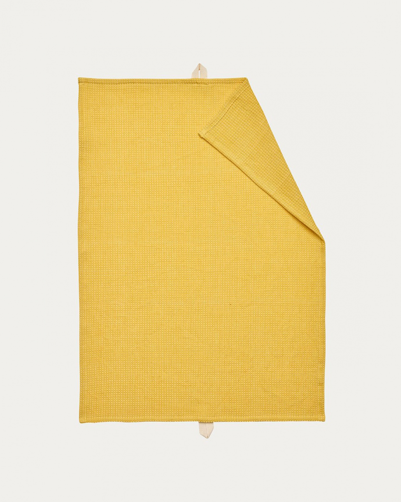 Product image mustard yellow AGNES kitchen towel made of soft cotton in a waffle structure from LINUM DESIGN. Size 50x70 cm.